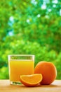 Orange and glass on the table