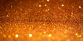 Orange glitter lights. Shiny sparkles, bokeh effects, glowing surface. Selective focus, christmas abstract banner Royalty Free Stock Photo