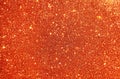 Orange glitter texture background. Stars Sparkle Background, Vibrant bright glitter background.