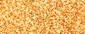 Orange glitter texture, banner macro photo, high detailed surface. Close-up to sandpapper, abstract glitter lights for Royalty Free Stock Photo