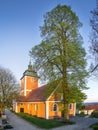 Orange, glowing church under a blue sky Royalty Free Stock Photo