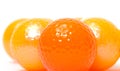 Orange and golden golf balls Royalty Free Stock Photo