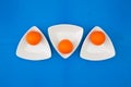 Orange golf balls on the triangular ceramic bowls