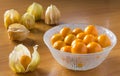 Orange gooseberries in bowl and on tables