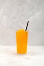 Orange Granizado in tall clear glass. Spanish Refreshing summer iced drink. Slushie fruit drink. Sweet Shaved ice Royalty Free Stock Photo