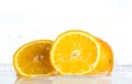Orange and grapefruit in a spray of water on a white background Royalty Free Stock Photo