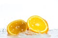 Orange and grapefruit in a spray of water on a white background Royalty Free Stock Photo