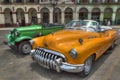 Orange and green cars in front of Capitolio, Havana, Cuba Royalty Free Stock Photo