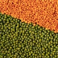 Orange and green lentils background Royalty Free Stock Photo