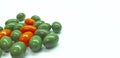 Orange and green pills Royalty Free Stock Photo