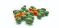 Orange and green pills Royalty Free Stock Photo