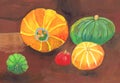 Orange and green pumpkins on a brown background. Children`s drawing gouache, paper