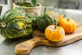 Orange And Green Pumpkins On A Wooden Tray.Table Decoration. Halloween. Autumn Harvest.