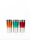 Orange, green and red thermos bottle on white background Royalty Free Stock Photo