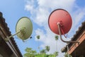 Orange green Satellite Dish under blue sky Royalty Free Stock Photo