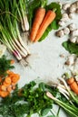 Orange and green veggies and roots composition on a dark slate t Royalty Free Stock Photo