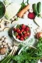 Orange and green veggies and roots composition on a dark slate t Royalty Free Stock Photo