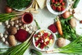 Orange and green veggies and roots composition on a dark slate t Royalty Free Stock Photo