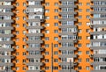 Orange and grey brick house with many windows and balcony Royalty Free Stock Photo