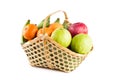 Orange, guava, banana and apple in wicker basket on white background fruit health food isolated Royalty Free Stock Photo