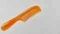 Orange hair comb on a white background. Royalty Free Stock Photo