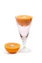 Orange halves and pink glass