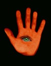 Orange hand with green eye in palm