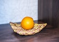 Orange in a handmade dish in the interior.