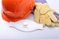 Orange hard hat, goggles, protective mask, respirator and safety gloves on a white background. Royalty Free Stock Photo