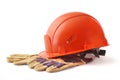 Orange hard hat, safety gloves on white background. Safety helmet. Royalty Free Stock Photo