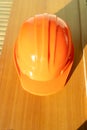 Orange hard safety helmet hat for safety workman.