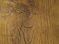 Orange hardwood board table with knot hole and annual rings nat