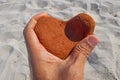 Orange heart shaped stone at the beach Royalty Free Stock Photo