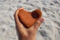 Orange heart shaped stone at the beach Royalty Free Stock Photo