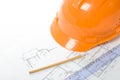 Orange helmet, pencil, ruler and blueprint Royalty Free Stock Photo