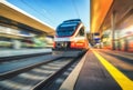 Orange high speed train in motion on the railway station Royalty Free Stock Photo