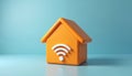 Orange home model features wireless icon on blue background. Design represents smart home, technology, internet. Symbol of modern Royalty Free Stock Photo