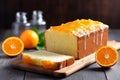 Orange homemade pound cake. Moist loaf with orange zest on bright background. Generative AI Royalty Free Stock Photo