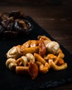 Orange honey mushrooms, marinated Armillaria mushroom on dark