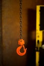 Orange hook and rusty chain Royalty Free Stock Photo