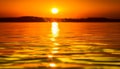 Orange horizon glows, tranquil water ripples in summer heat generated by AI