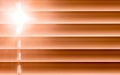 Orange horizontal blinds on the window create a rhythm through t