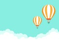 Orange hot air balloon flying in blue sky with clouds. Flat cartoon horizontal background Royalty Free Stock Photo