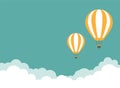 Orange hot air balloon flying in the turquoise sky with clouds. Vector background Royalty Free Stock Photo