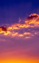 Orange hued clouds on colorful sunset sky Royalty Free Stock Photo