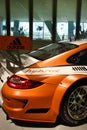 Orange hybrid car at the Porsche museum