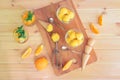 Orange ice cream, orange lemonade, ice cream cones  and fresh oranges on rustic wooden table. Top view Royalty Free Stock Photo