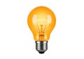 Orange incandescent light bulb on a white background, symbolizing ideas Royalty Free Stock Photo