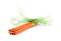 Orange incense sticks tied with green tie on white Royalty Free Stock Photo
