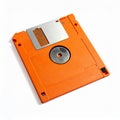 Orange 3.5 Inch Floppy Disk with Metal Shutter and Center Hub on White Background diskette Royalty Free Stock Photo